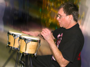man playing bongos