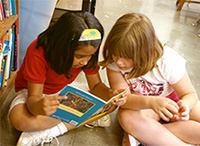 Two girls reading