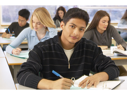 Boy at desk writing