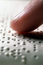 finger on a braille page