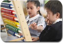 Two students use an abacus