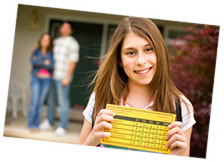 Girl holding her report card