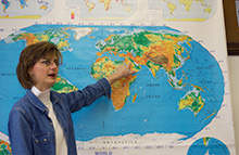 Teacher pointing to a map
