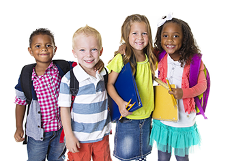 group of young children standing around smiling