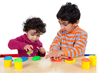 two boys working with blocks