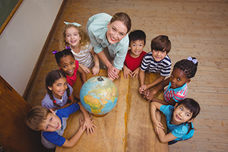 teacher and class with globe