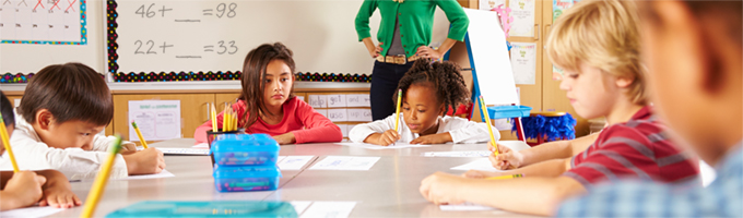 Children working on assignment at table