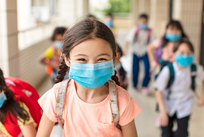school girl wearing mask