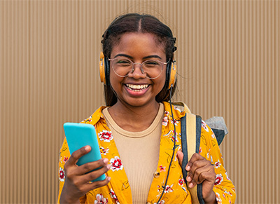 girl listening to audio with headphones