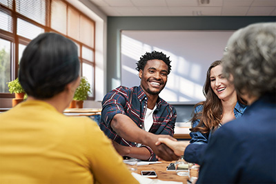 group of adults meeting around a table